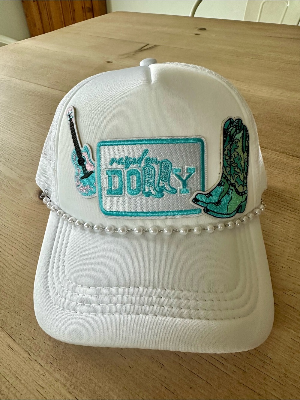 Raised on Dolly trucker hat